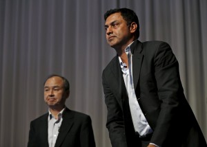 SoftBank Corp. Chief Executive Masayoshi Son (L) and Nikesh Arora, former Google chief business officer and currently SoftBank Vice Chairman, leave a news conference in Tokyo May 11, 2015. Son said on Monday that Vice Chairman Nikesh Arora was a strong candidate to lead the Japanese telecommunications and Internet conglomerate in the future. REUTERS/Issei Kato